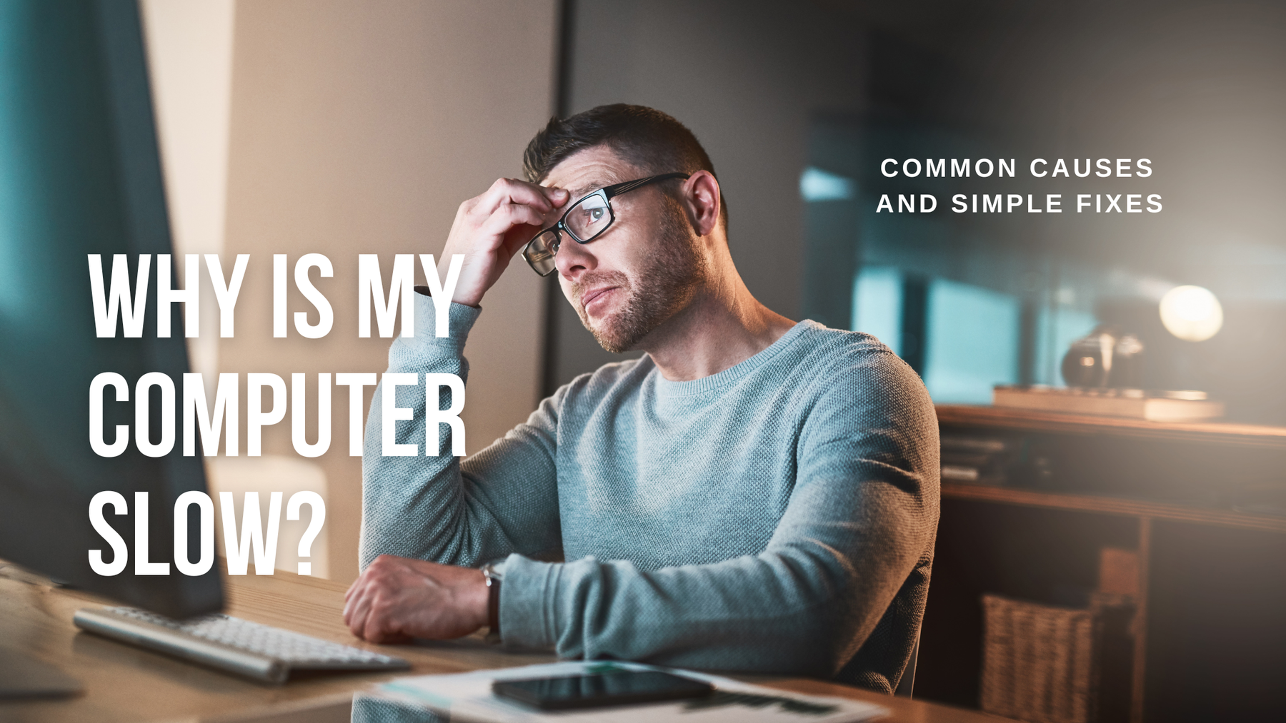 man next to slow computer upset and looking for fixes to problems